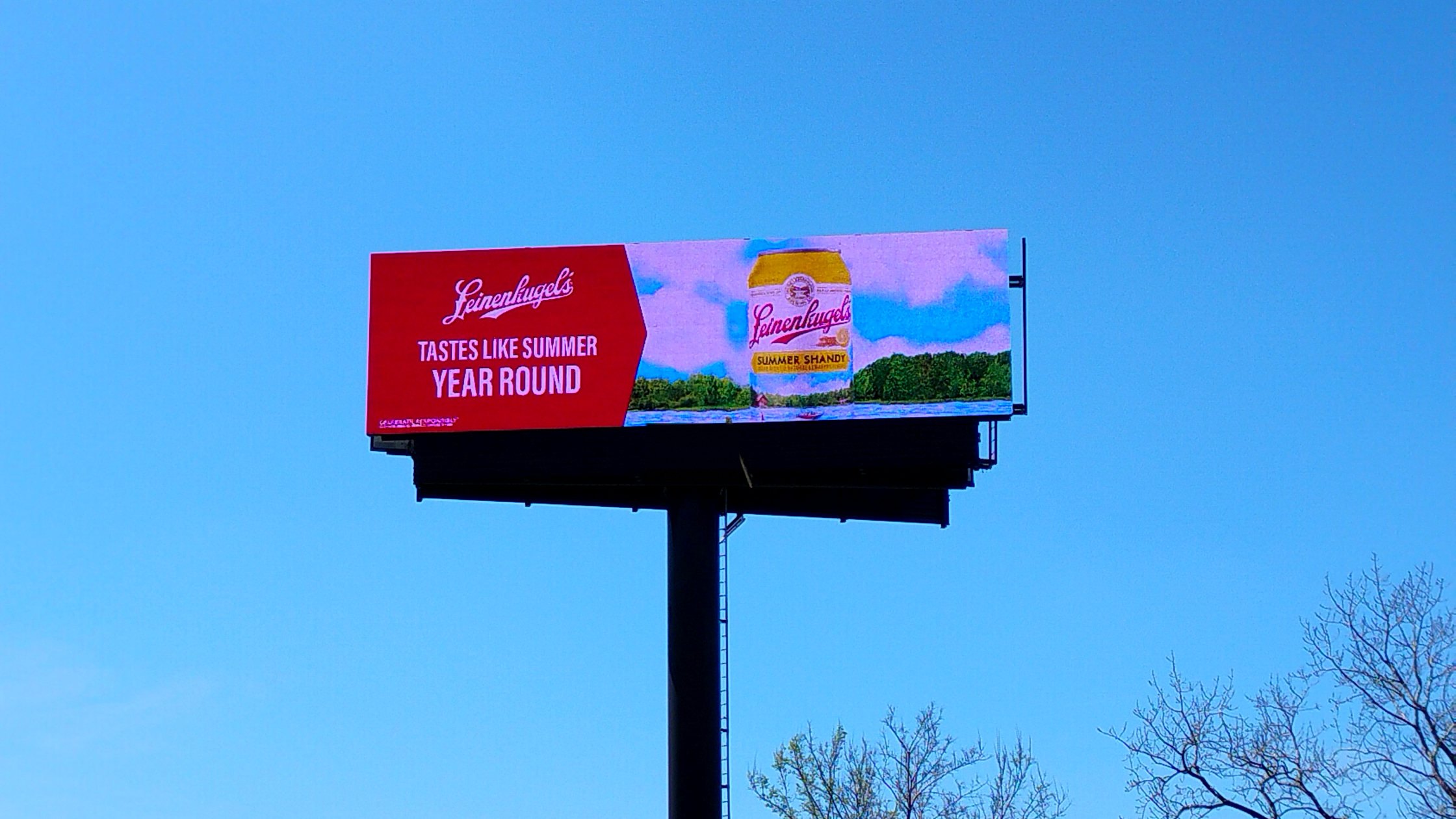 Digital billboard above the treeline