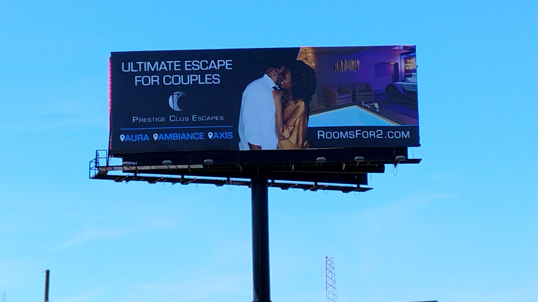 Billboard on a monopole with a second sign in the distance
